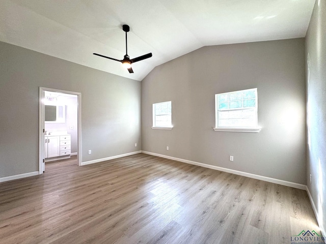 interior space with ceiling fan, lofted ceiling, and light hardwood / wood-style floors