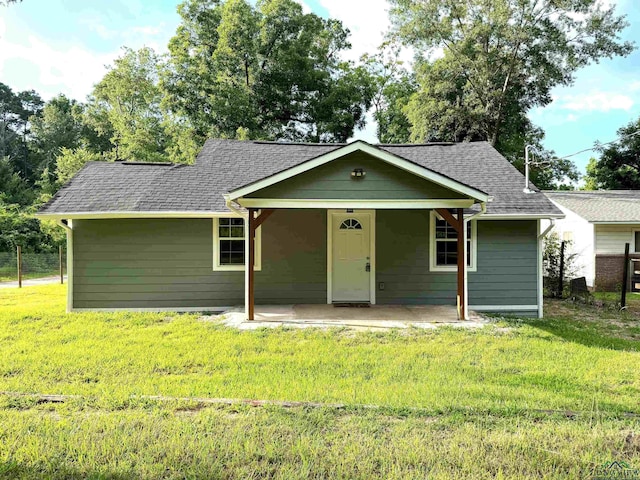 single story home with a patio and a front lawn