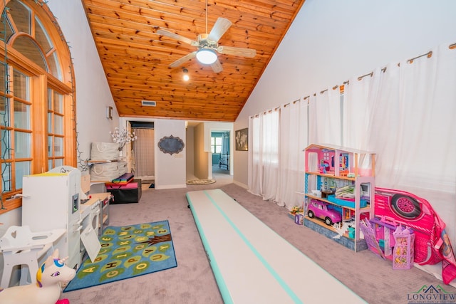 rec room with ceiling fan, light colored carpet, wood ceiling, and high vaulted ceiling