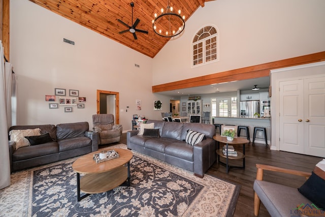 living room featuring ceiling fan with notable chandelier, wood-type flooring, wood ceiling, and high vaulted ceiling