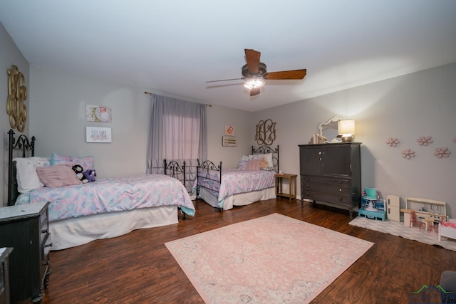 bedroom with ceiling fan and dark wood-type flooring