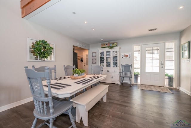 dining area with dark hardwood / wood-style flooring