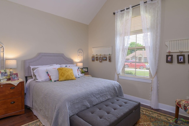 905 Woodridge Cir, Longview, TX 75601 - bedroom with wood finished floors, baseboards, and high vaulted ceiling