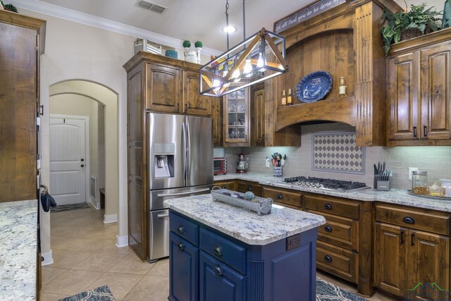 905 Woodridge Cir, Longview, TX 75601 - kitchen featuring stainless steel appliances, crown molding, decorative backsplash, light tile patterned floors, and decorative light fixtures
