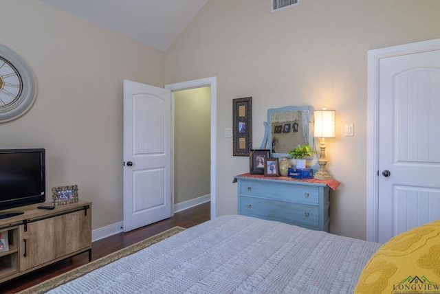 905 Woodridge Cir, Longview, TX 75601 - bedroom featuring dark wood-style flooring, baseboards, and high vaulted ceiling