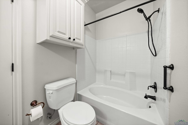 bathroom featuring shower / bathing tub combination and toilet