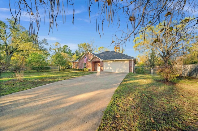 single story home with a garage and a front lawn