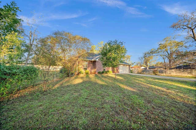 view of yard featuring a garage