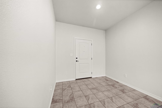 unfurnished room with light tile patterned floors