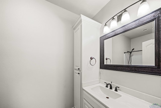 bathroom with a shower and vanity