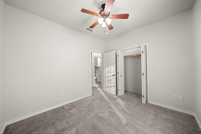 unfurnished bedroom with a closet, light colored carpet, and ceiling fan