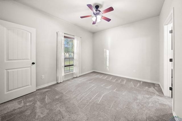 unfurnished bedroom with light colored carpet and ceiling fan