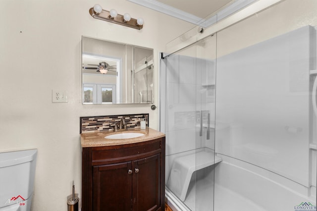 bathroom with toilet, a shower with shower door, crown molding, vanity, and decorative backsplash