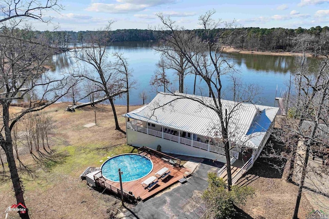 view of swimming pool with a water view