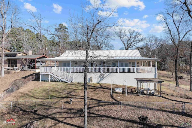 back of property featuring covered porch