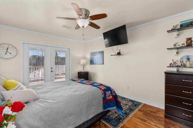 bedroom featuring dark hardwood / wood-style floors, ornamental molding, access to exterior, ceiling fan, and french doors