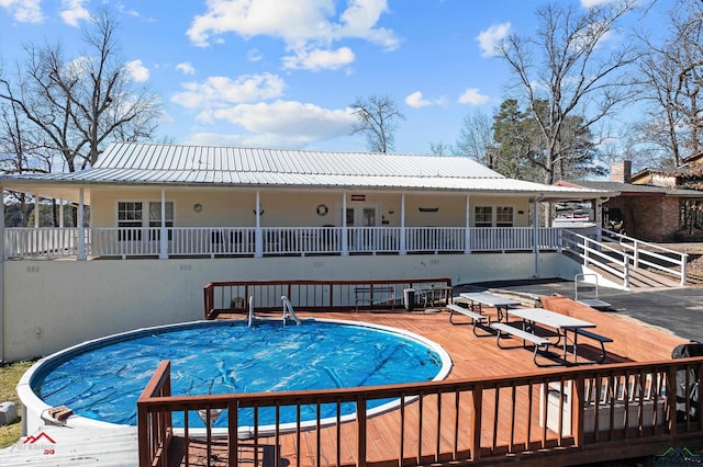 view of pool with a wooden deck