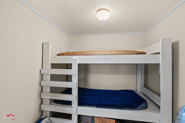 unfurnished bedroom with crown molding and a textured ceiling