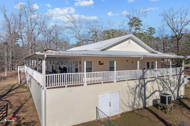 view of front of home featuring french doors and central air condition unit