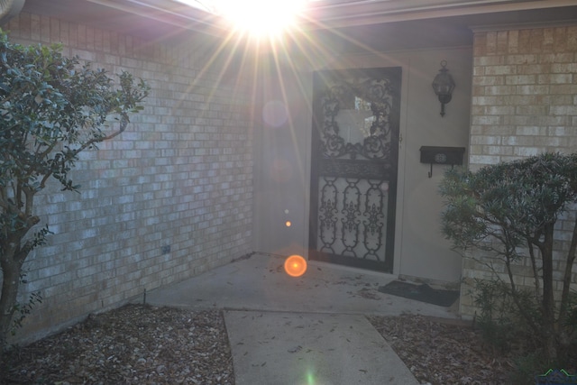 doorway to property with a patio