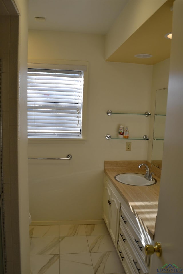 bathroom with vanity and toilet