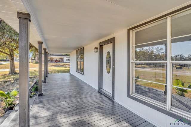 wooden deck featuring covered porch