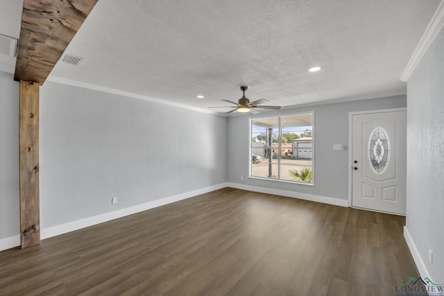 entrance foyer featuring a textured ceiling, dark hardwood / wood-style flooring, ceiling fan, and ornamental molding