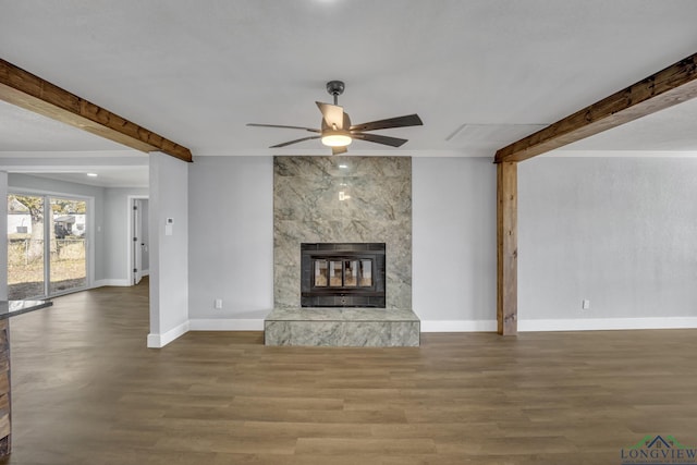 unfurnished living room featuring hardwood / wood-style floors, ceiling fan, ornamental molding, and a high end fireplace