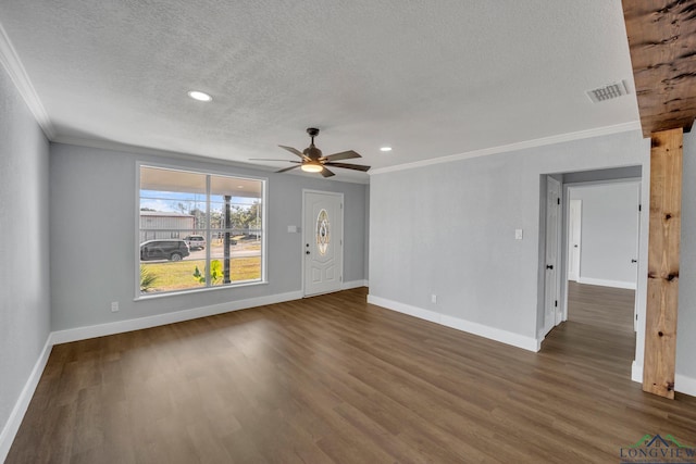 unfurnished living room featuring dark hardwood / wood-style flooring, ceiling fan, crown molding, and a textured ceiling