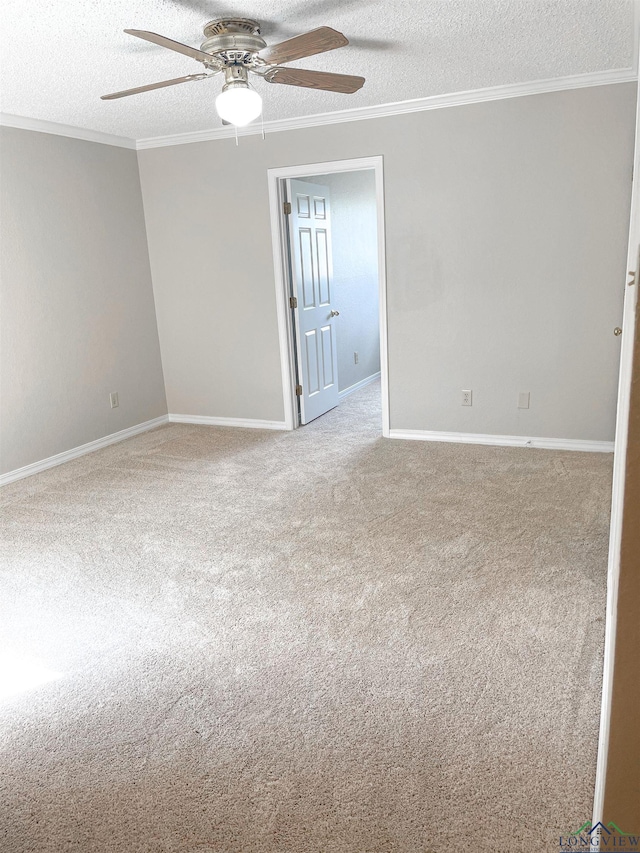 1204-1206 Brandywine, Longview, TX 75601 - empty room featuring a textured ceiling, a ceiling fan, ornamental molding, and carpet flooring