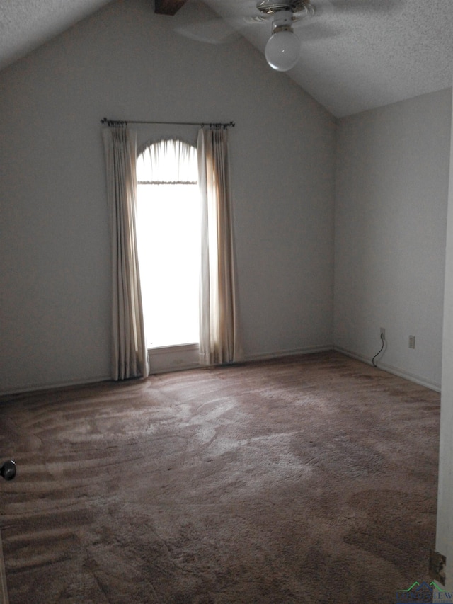 1204-1206 Brandywine, Longview, TX 75601 - spare room featuring a ceiling fan, vaulted ceiling, a textured ceiling, and carpet flooring