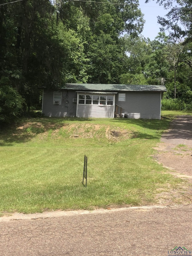 2408 Blairs Landing Rd, Karnack, TX 75661 - ranch-style home with a front lawn