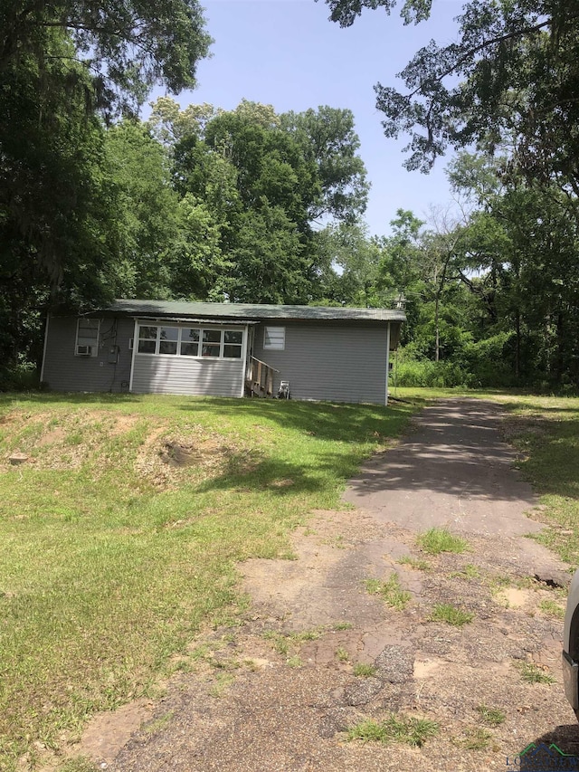 2408 Blairs Landing Rd, Karnack, TX 75661 - view of front of property featuring a front lawn