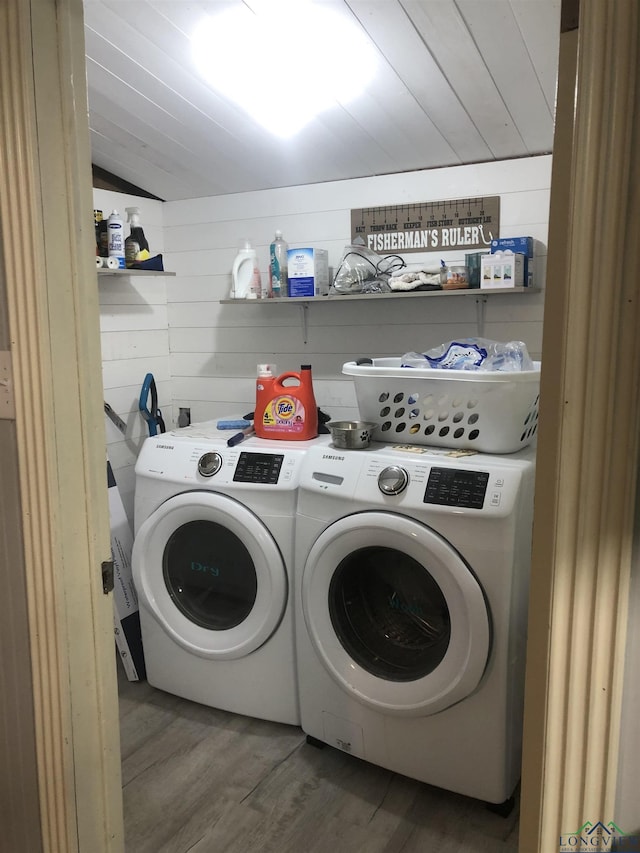2408 Blairs Landing Rd, Karnack, TX 75661 - clothes washing area featuring washer and dryer and wood finished floors