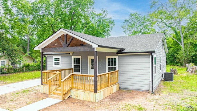 view of front of house with central air condition unit and a porch