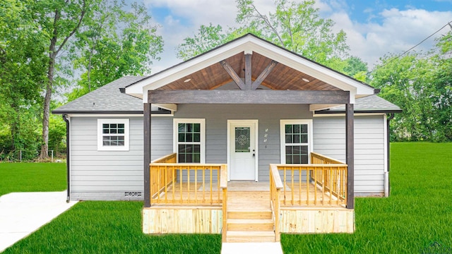 view of front of house featuring covered porch and a front lawn