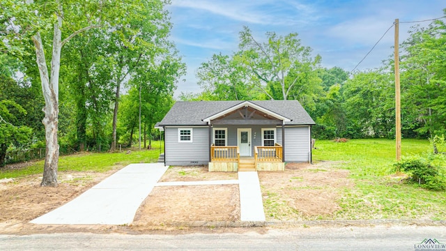 bungalow-style home with a porch and a front lawn