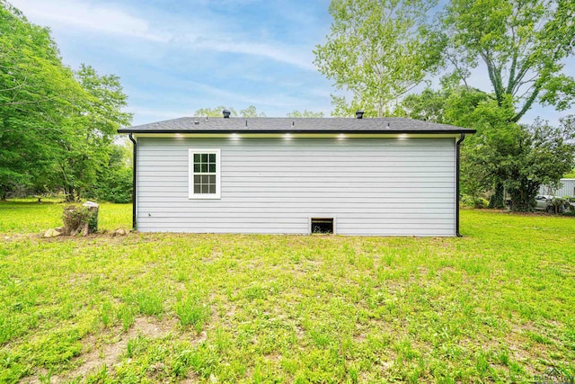 view of home's exterior with a lawn