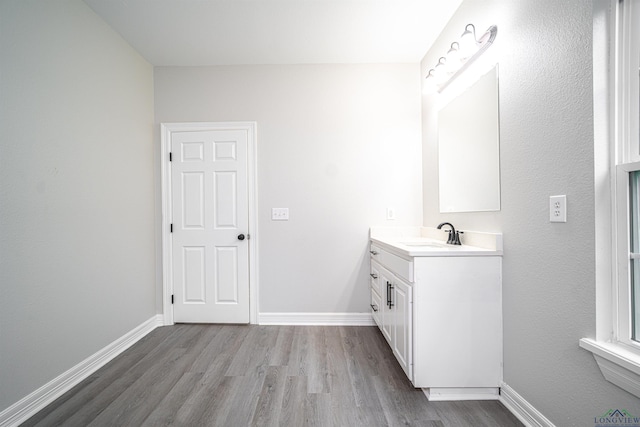 bathroom featuring hardwood / wood-style floors and vanity