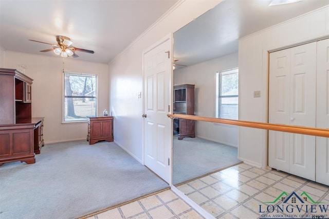 354 Royal Cir, Whitehouse, TX 75791 - entrance foyer featuring a ceiling fan, healthy amount of natural light, light colored carpet, ornamental molding, and light flooring