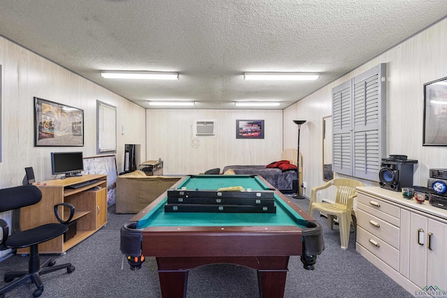 rec room with carpet, billiards table, a wall mounted air conditioner, a textured ceiling, and wood walls