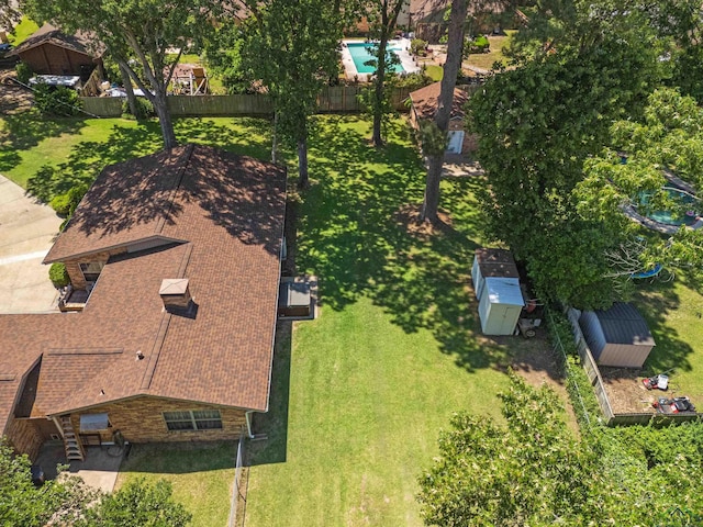 view of subject property with a pool