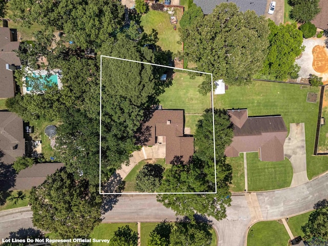 aerial view of property and surrounding area featuring property parcel outlined
