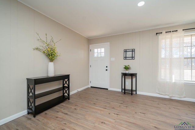 3697 N White Oak Rd, Gladewater, TX 75647 - entrance foyer featuring wood finished floors, baseboards, and crown molding