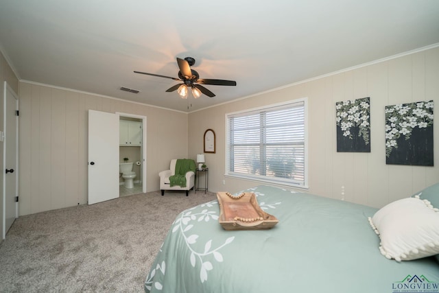 3697 N White Oak Rd, Gladewater, TX 75647 - bedroom featuring carpet floors, ornamental molding, connected bathroom, and ceiling fan