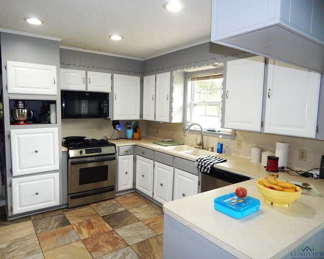 kitchen featuring white cabinets, ornamental molding, sink, and appliances with stainless steel finishes