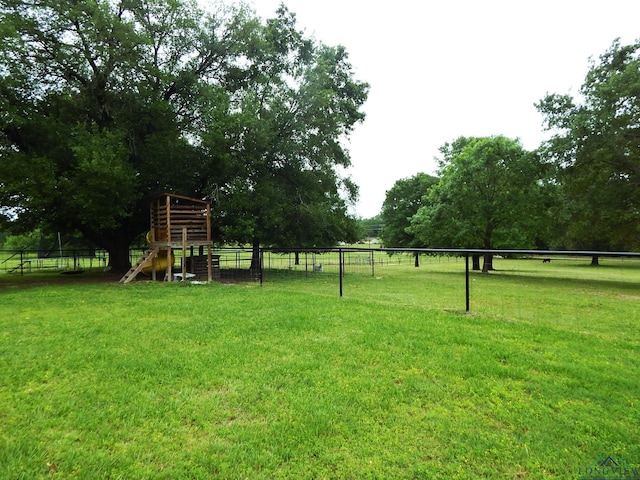 view of yard with a rural view and a playground