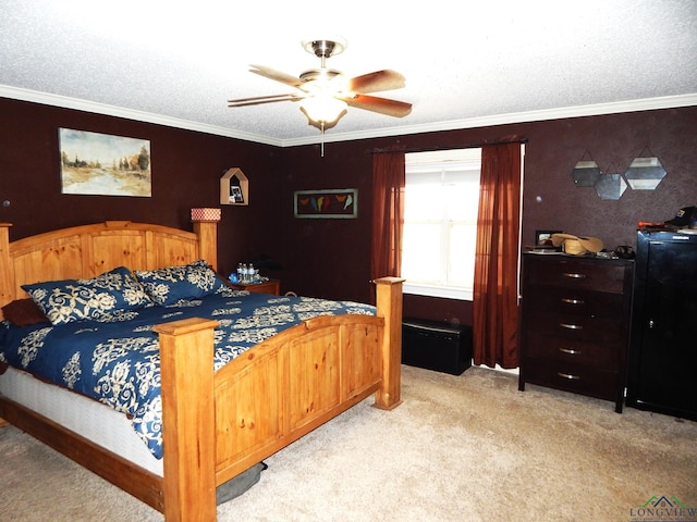 carpeted bedroom with ceiling fan, a textured ceiling, and ornamental molding