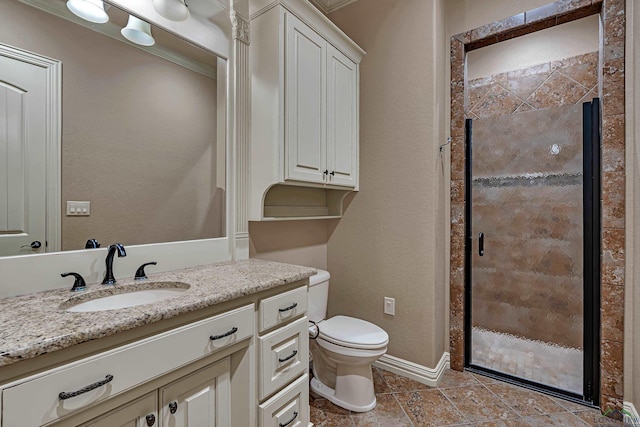 bathroom with toilet, vanity, baseboards, tile patterned floors, and a stall shower