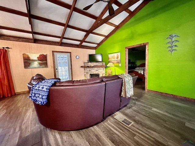 living room featuring beam ceiling, ceiling fan, dark wood-type flooring, coffered ceiling, and a fireplace